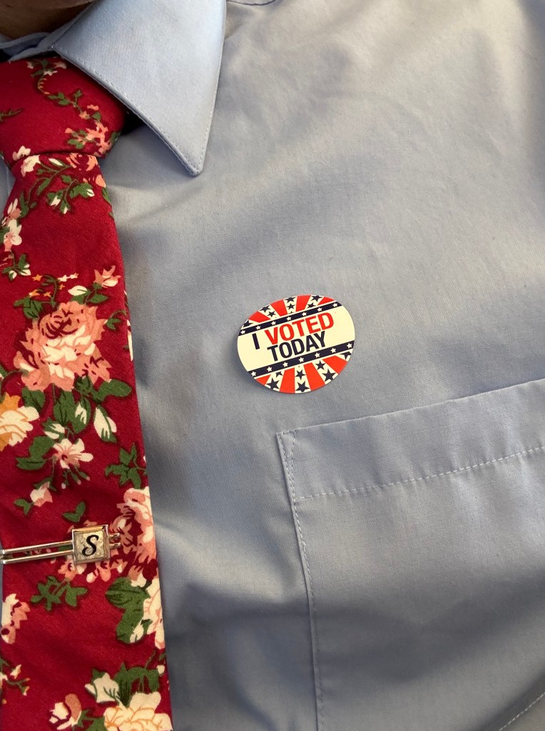 picture of an "I Voted Today" sticker on a blue shirt